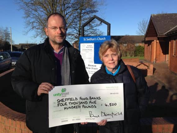 Mr Blomfield and Deni Ennals, Co-Chair of Sheffield Foodbank Network, outside the S2 Foodbank at St Swithins Church on the Manor