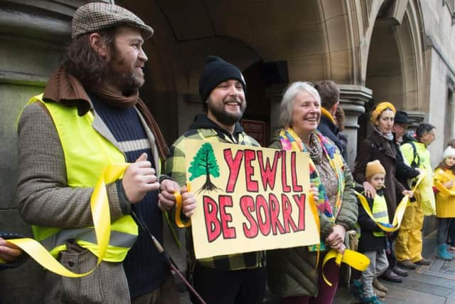 Protesters circle the Town Hall in January.