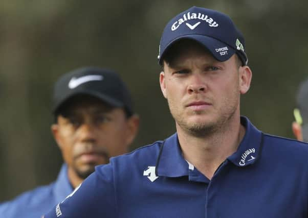 Danny Willett at the Dubai Desert Classic alongside playing partner Tiger Woods