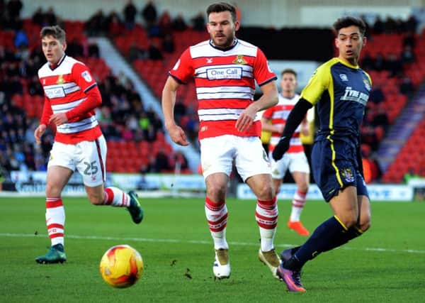 Doncaster Rovers captain  Andy Butler, centre