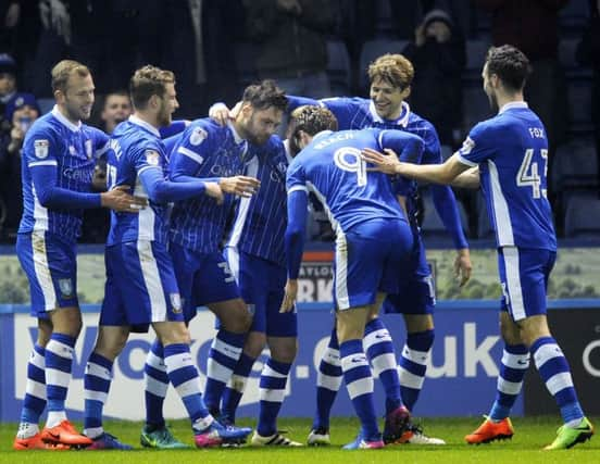 Two goal Vincent Sasso mobbed by team mates....Pic Steve Ellis