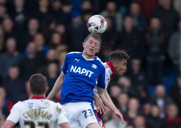 Chesterfield vs Sheffield United - Tom Anderson heads the ball  - Pic By James Williamson