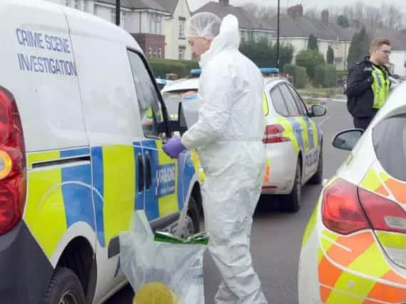 Police at the scene of a shooting in Butterthwaite Road