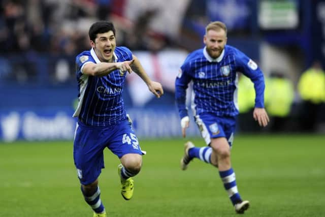 Barry Bannan leads the chase as Fernando Forestieri runs off to celebrate his goal....Pic Steve Ellis