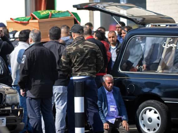 Aseel's coffin is carried into the mosque