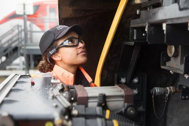 A library image of an Hitachi train maintenance worker