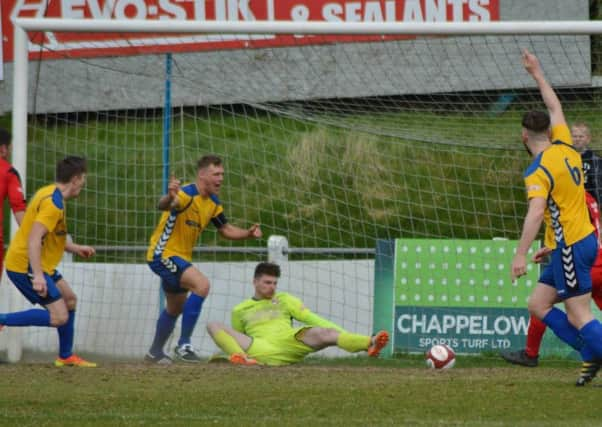 Stocksbridge captain Liam McFadyen  puts them 3-1 up. Photo Gillian Handsides