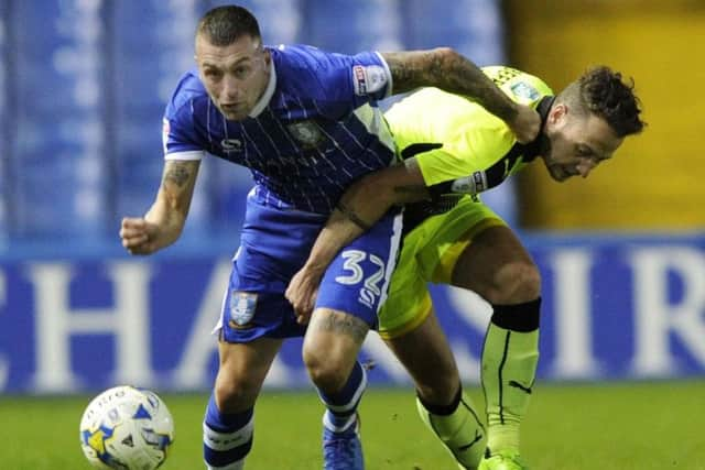 Jack Hunt holds off Reading's Danny Williams