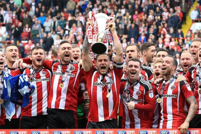 Sheffield United celebrate winning the League One title