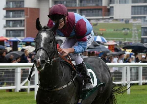 Bengali Boys, ridden by Barry McHugh and trained by Richard Fahey, storms to an easy victory in the big race of the weekend at rain-soaked Newbury, the Weatherbys Super Sprint for 2yos.