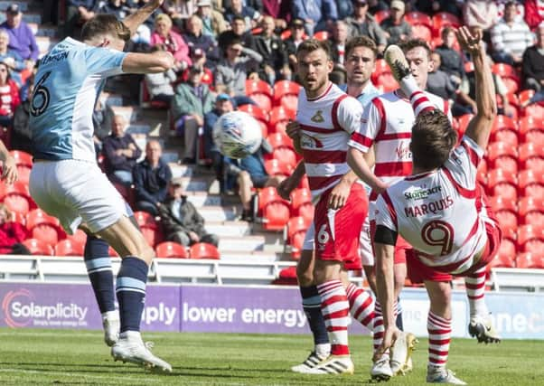 John Marquis scores the spectacular second goal for Rovers. Photo: Dean Atkins