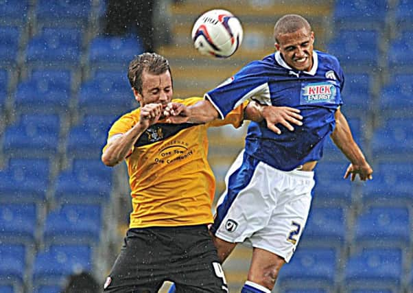 Chesterfield V Rotherham United 
Jordan Bowery jumps with Kari Arnason