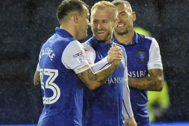 Harry Owls trio with the three hard earned points Ross Wallace,Barry Bannan,and Jack Hunt....Pic Steve Ellks