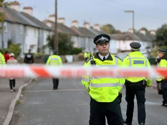 Police officers taking part in an operation in Cavendish Road, Sunbury-on-Thames, Surrey, as part of the investigation into the Parsons Green bombing.