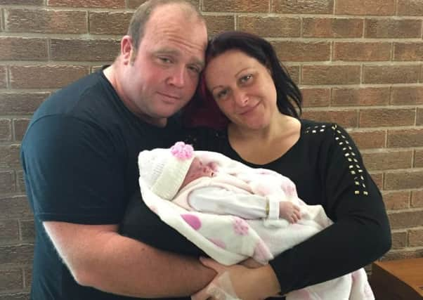 Lisa Fletcher, of Killamarsh, Sheffield, with daughter Lillie Grace and husband Nik. Lillie Grace was born stillborn in October 2015, and since then Lisa has set up charity 'Dresses for Angels' and makes care packages for other families who also lose a baby.