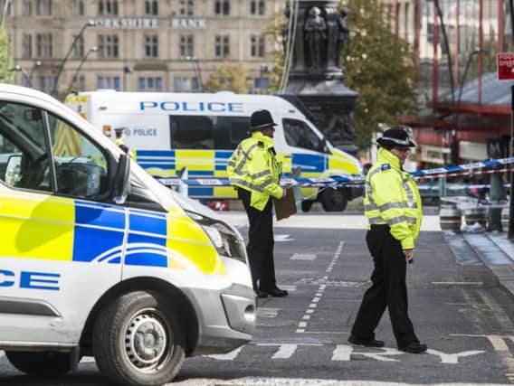 Police corden off an area of Barkers pool in Sheffield city centre following multiple stabbings