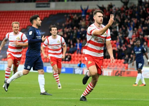 Ben Whiteman celebrates scoring from the penalty spot to complete his quickfire hat trick. Photos: Chris Etchells