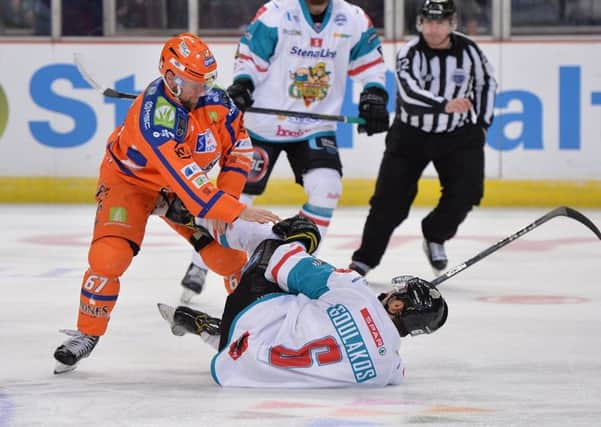 Colton Fretter goes for Belfast player Spiro Goulakos. Pic: Dean Woolley