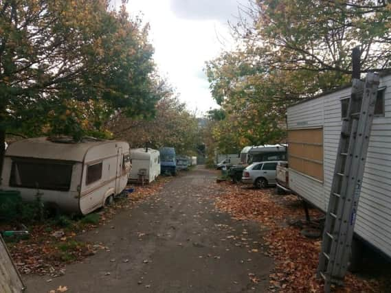 Some of the caravans and other vehicles on the travellers encampment below the old Ski Village site