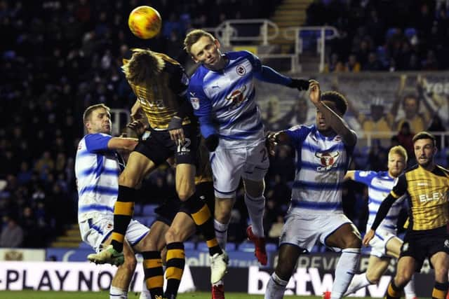 Glenn Loovens goes up for an aerial challenge