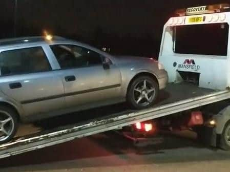 Car being towed by police (s)