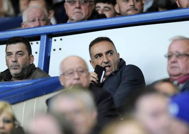 Carlos Carvalhal sitting in the directors' box watching the Owls beat Nottingham Forest last September