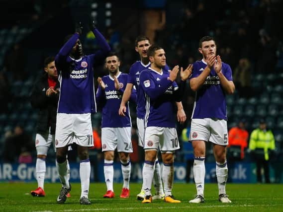 United's players applaud their fans at Preston