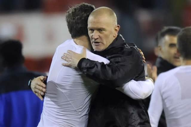 Victory hug from Lee Bullen for Adam Reach....Pic Steve Ellis