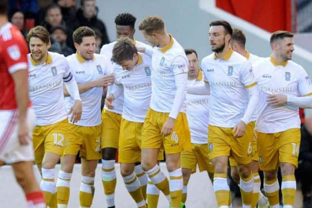 Owls players celebrate after Adam Reach put Wednesday in front