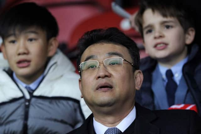 Owls owner Dejphon Chansiri watches at Griffin Park