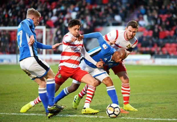 Doncaster's Niall Mason and captain Andy Butler