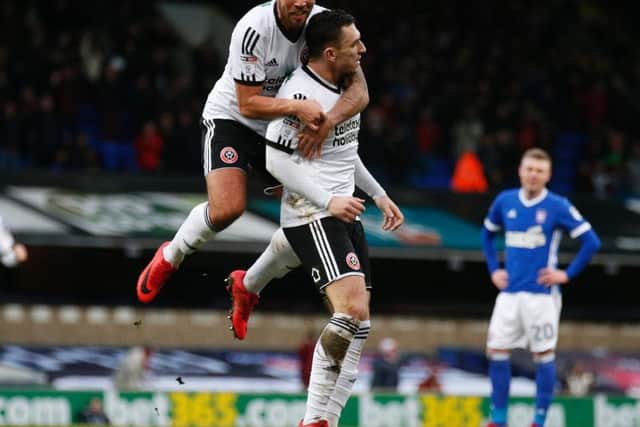 Nathan Thomas celebrates his goal with Samir Carruthers