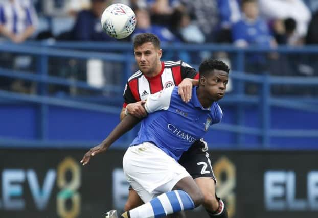 George Baldock of Sheffield Utd and Lucas Joao of Sheffield Wednesday