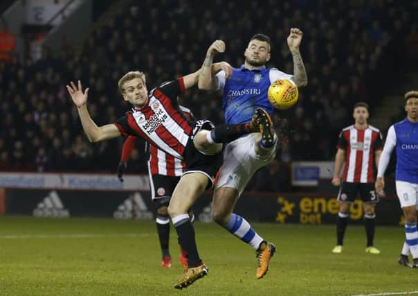 James Wilson of Sheffield Utd challenges Daniel Pudil of Sheffield Wednesday