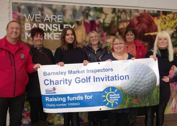 Neil Hardcastle and some of the market traders and market staff who havehelped raise Â£30,000 for Sheffield Hospitals Charity