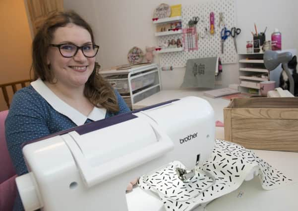 Ellie Mason with some of her embroidered hoops she sells through her company Fizzy Pigg