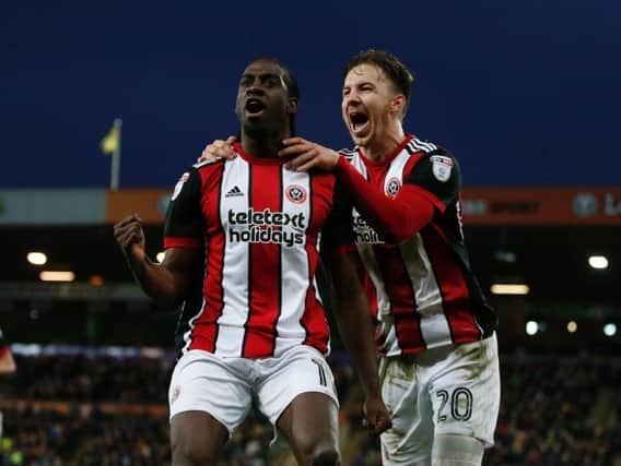 Clayton Donaldson celebrates his goal with Lee Evans