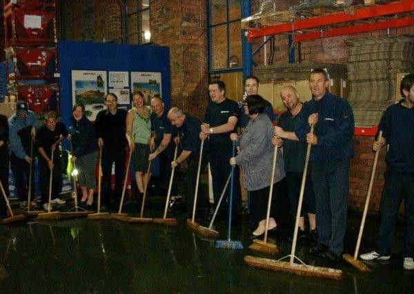 Staff at Gripple begin the clean-up following the 2007 flood