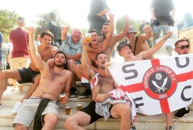 Joe Highfield, centre, front row, in Malaga with his mates for United's pre-season tour last summer