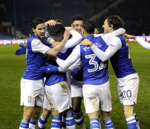 Owls players mob two goal Lucas Joao.....Pic Steve Ellis