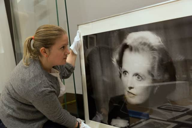 Project Curator  Louisa Briggs installing  Paul Trevor, Margaret Thatcher, on Television,  at Changing Lives: 200 Years of People and Protest in Sheffield at Weston Park Museum
 Â© Museums Sheffield