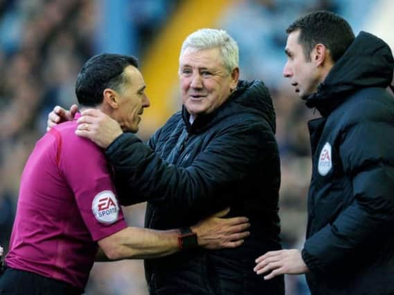 Steve Bruce shares a joke with referee Neil Swarbrick during Aston Villa's 4-2 win at Sheffield Wednesday