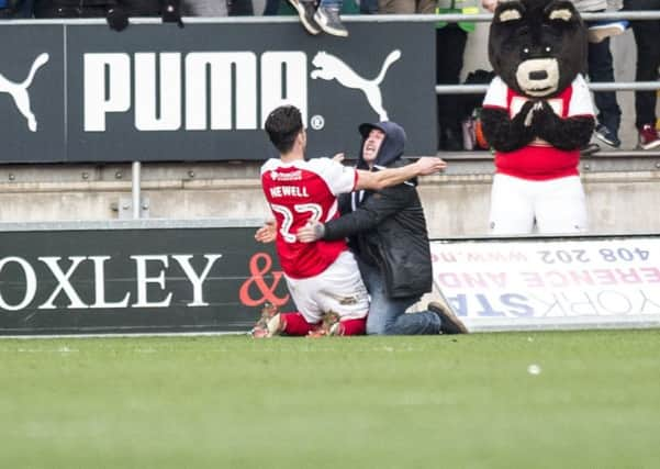 Joe Newell celebrates after scoring the winner against Doncaster Rovers