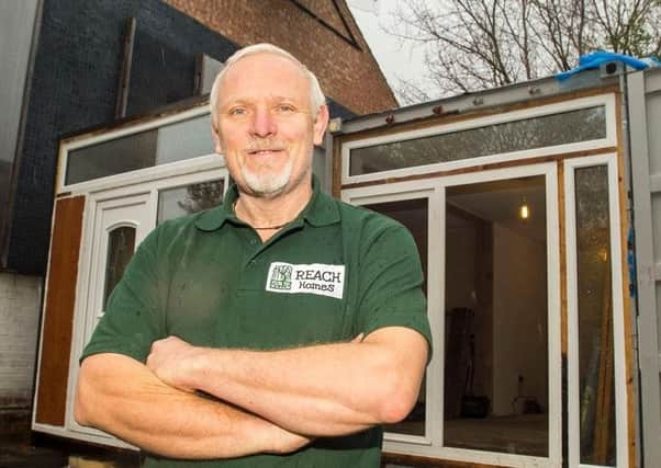 Jon Johnson outside a prototype eco-house