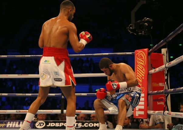 Kid Galahad (left) knocks down Irving Berry in their Featherweight contest at the FlyDSA Arena, Sheffield. Pic:  Richard Sellers/PA Wire