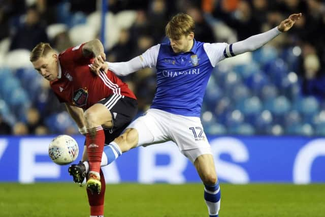 Owls skipper Glenn Loovens stretches out to stop Town's two goal Martyn Waghorn.....Pic Steve Ellis