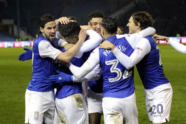 Owls players mob two goal Lucas Joao.....Pic Steve Ellis