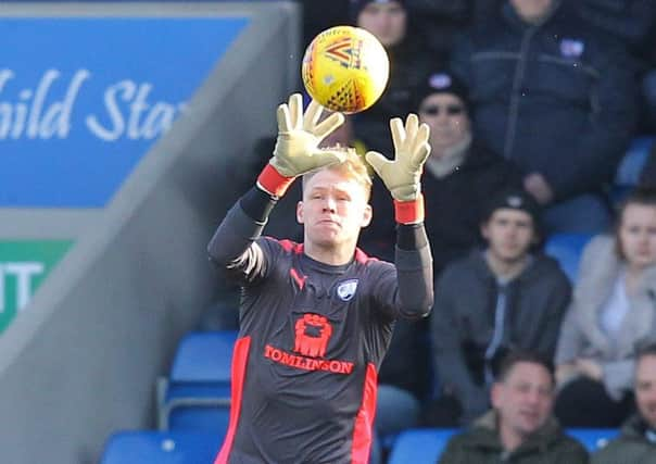 Aaron Ramsdale claims a cross