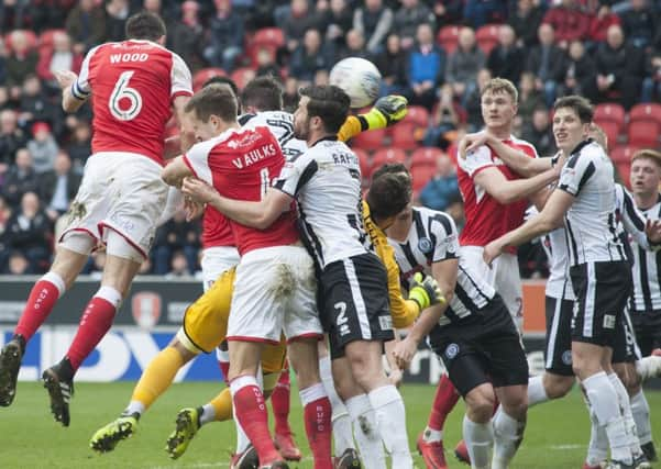 Richard Wood heads the ball into the net. Pictures: Dean Atkins