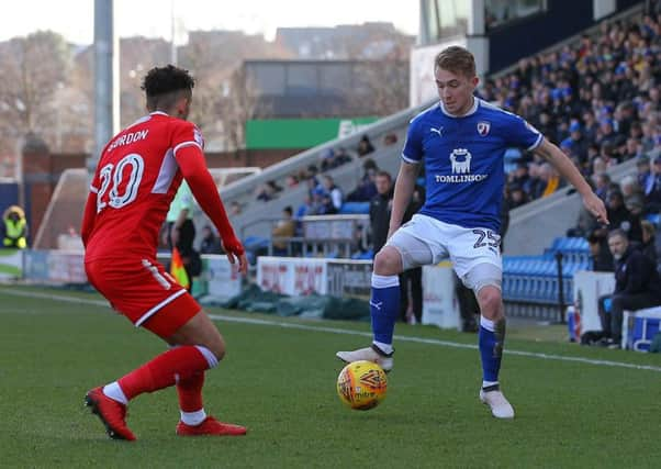 Picture by Gareth Williams/AHPIX.com; Football; Sky Bet League Two; Chesterfield FC v Swindon Town; 24/03/2018 KO 15.00; Proact Stadium; copyright picture; Howard Roe/AHPIX.com; Louis Reed is confronted by Swindon's Kellan Gordon